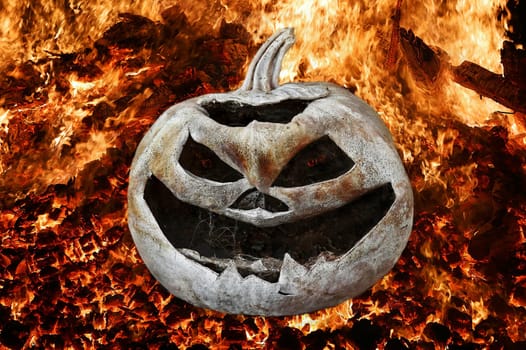 A spooky Halloween pumpkin head in a glowing fire