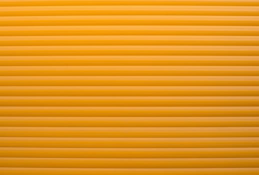 Textured wall structure, background with copy space for text, crunchy backdrop, orange window cover, close up