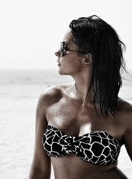 Fashion shot of beautiful woman on the beach in Dubai