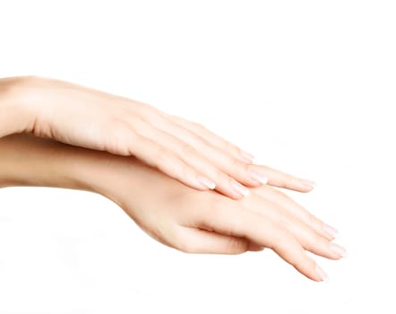 Female hands with french manicure isolated over white