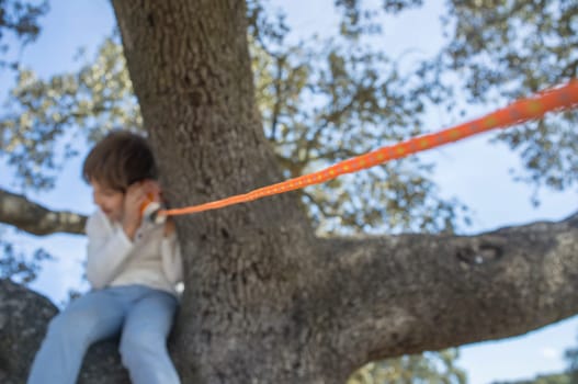 Child boy listening with a tin can telephone. Selective focus