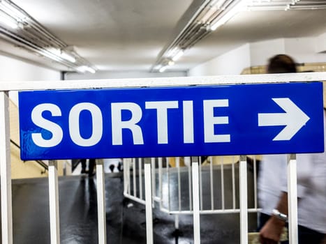 vintage exit sign at Metro in Paris, France