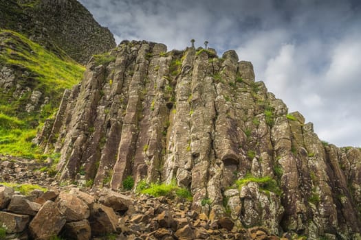 Closeup on hexagonal rock formation, interlocking basalt columns in Giants Causeway, Wild Atlantic Way and UNESCO world heritage, Northern Ireland