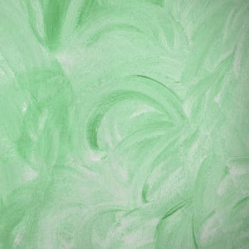 Green wall painted in a Provence style. It can be used as background and texture.
