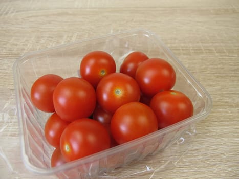 Cherry tomatoes packed in a plastic bowl