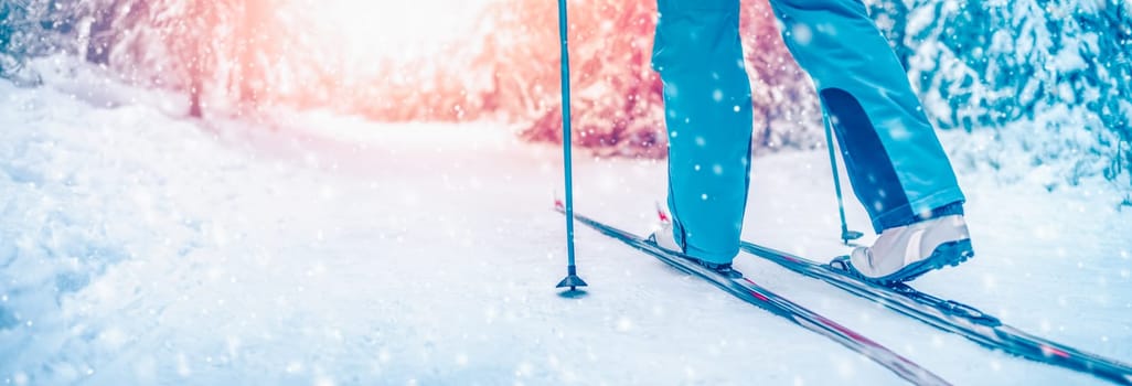 Skier foots in skis in the snowy winter forest. Concept of vacation and weekend.