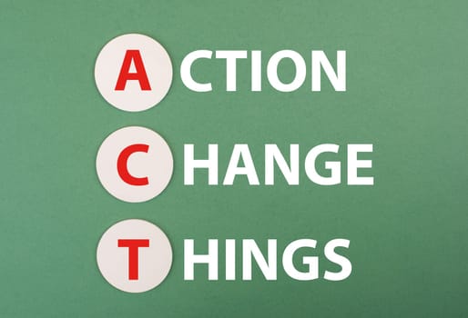 The words act, action, change, things are standing on a green colored background, business concept,achieving new goals