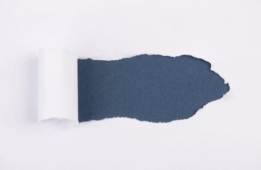 White torn paper, blue background, empty copy space, ripped sheet