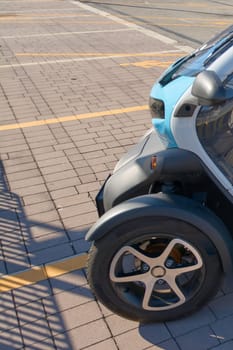 Civitavecchia, Italy - December 19, 2024: Front end of a modern electric vehicle. This electric vehicle is ideal for driving on city streets and promoting sustainable travel.