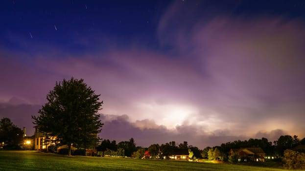 Nighttime view of a residential neighborhood in Central Kentucky with approaching thunderstorm