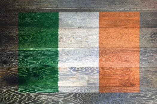 An Ireland flag on rustic old wood surface background