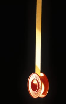 medical plaster hanging on a black background