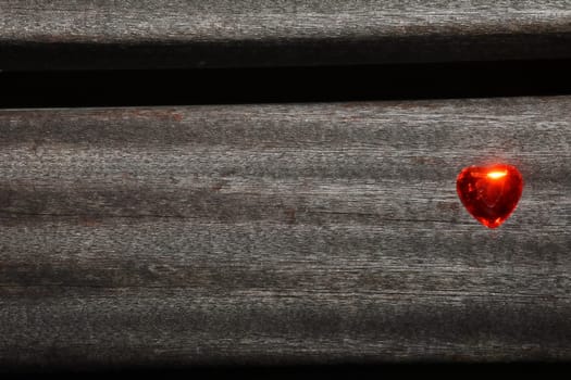 Heart on a plank of a park bench