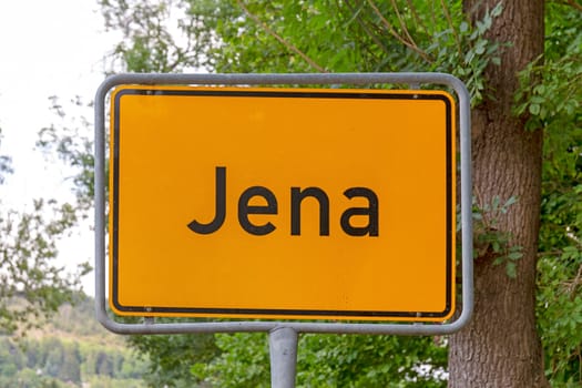 Jena city limit road sign in yellow
