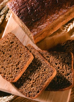 wholemeal bread with clumps of wheat on the table