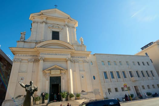 Civitavecchia. Italia - December 19, 2024: The blend of old and new in Civitavecchia, Italy, featuring a historic church and contemporary buildings. Concept: Urban contrast, architectural beauty.