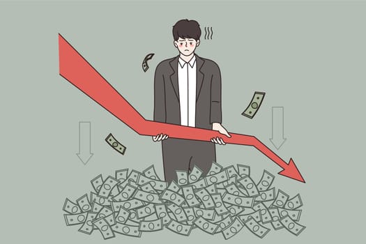 Distressed man in stack of money hold arrow facing down frustrated with business problems and failures. Unhappy businessman experience company financial crisis or bankruptcy. Vector illustration.