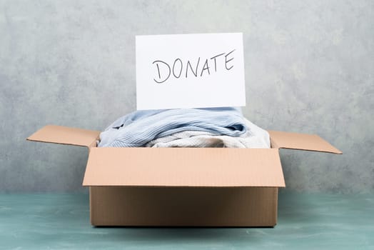 Package with used clothes for donation, second hand use for poor people, welfare
