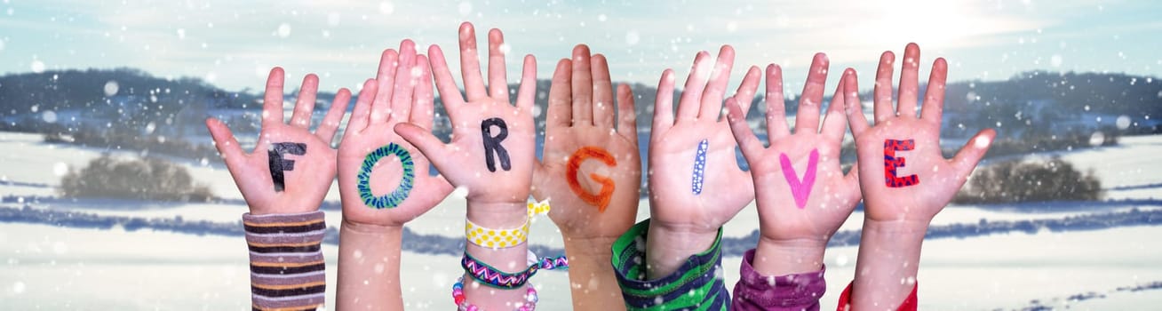 Children Hands Building Colorful English Word Forgive. Snowy Winter Background With Snowflakes