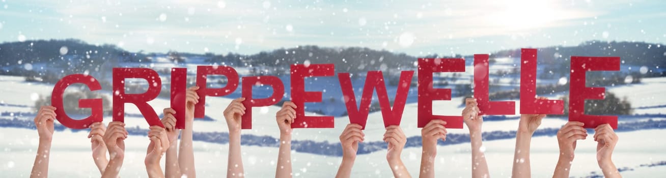 People Hands Holding Red German Word Grippewelle Means Flu Epidemic. Snowy Winter Background With Snowflakes