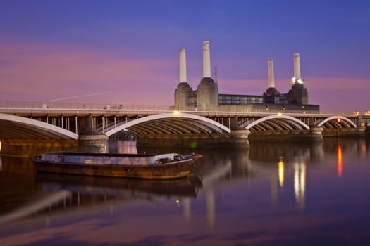A night scene of the Thames river Battersea Power Station and rail brige