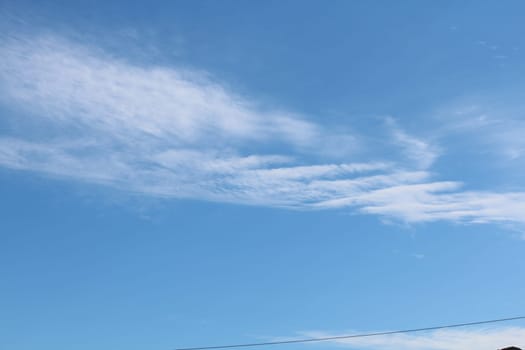 Blue sky background with clouds. white fluffy clouds on blue sky in summer
