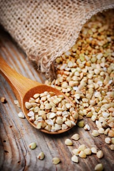 Closeup of buckweat in wooden spoon