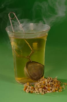 hot herbal tea in a glass ,green