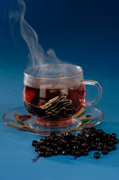 hot herbal tea in a glass ,blueberry