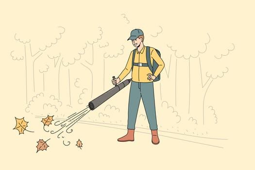 Cleaning park from fallen leaves concept. Young smiling man worker cartoon character in uniform standing and cleaning vacuuming fallen leaves in park vector illustration
