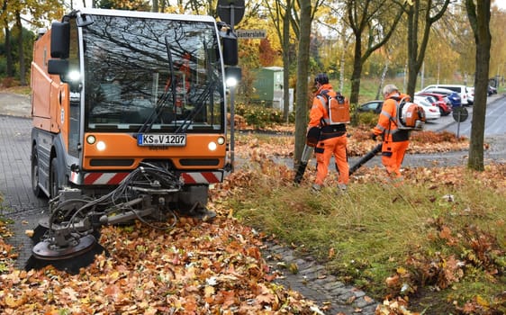 Sweeping machine in autumn