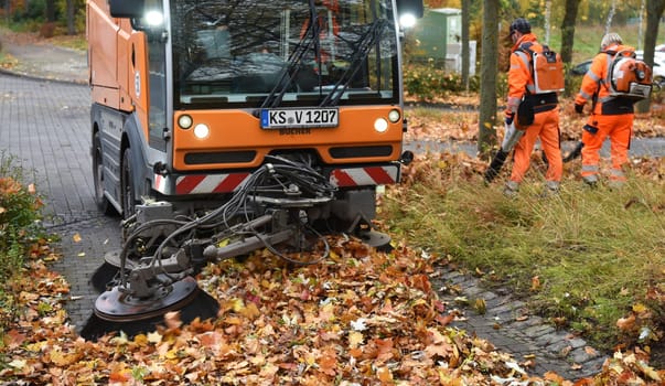 Sweeping machine in autumn