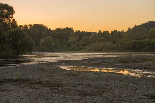 Summer sunset on the river , sunset by the water.