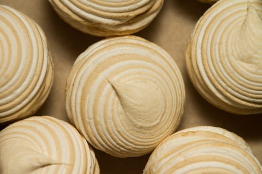 Sweet vanilla marshmallows on brown kraft paper. Meringue dessert