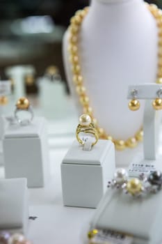 Artificial jewelry stones in the jewelry store window.