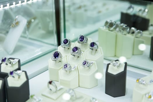Artificial jewelry stones in the jewelry store window.