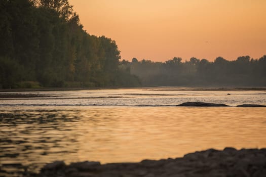 Summer sunset on the river , sunset by the water.