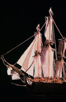 model of a three-masted ship in full sails