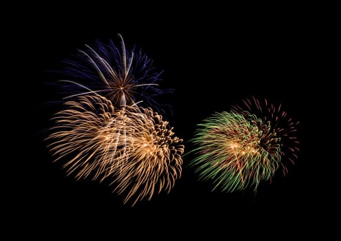 Colorful exploded fireworks display, isolated on black background