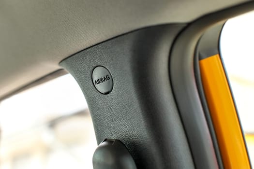 Detail on side airbag unit placement in the car.
