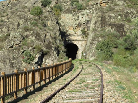 iron road bridges metal rail light at the end of the tunnel train transport