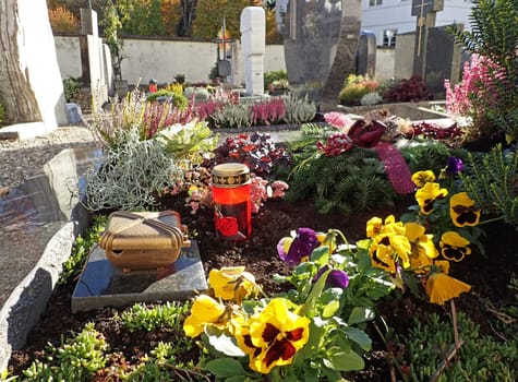 Beautifully decorated graves on a cemetery on All Saints Day in Bavaria