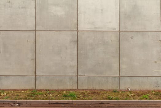 Gray concrete wall with lots of concrete shapes and grid lines