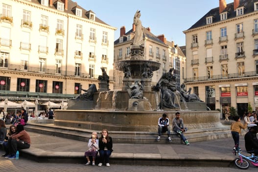 People in front of the Fountain on the Place Royale in Nantes