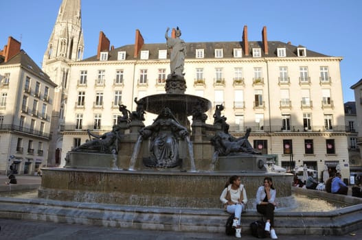 People in front of the Fountain on the Place Royale in Nantes