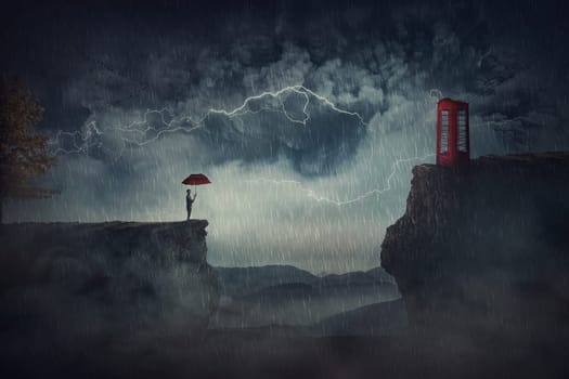 Person with an umbrella under the storm, stands on the edge of a cliff, need to pass the over side of precipice to reach a red phone booth. Fantastic scene, adventure journey, purpose and goal concept