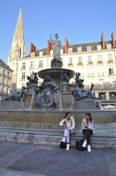 People in front of the Fountain on the Place Royale in Nantes
