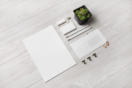 Blank corporate stationery for branding design. Corporate identity set on wooden background.