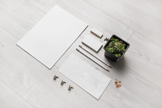 Blank corporate identity template on wooden background. Photo of blank stationery set. Mockup for design presentations and portfolios.