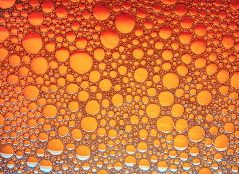 Orange bubbles background. Foam bubbles macro texture.